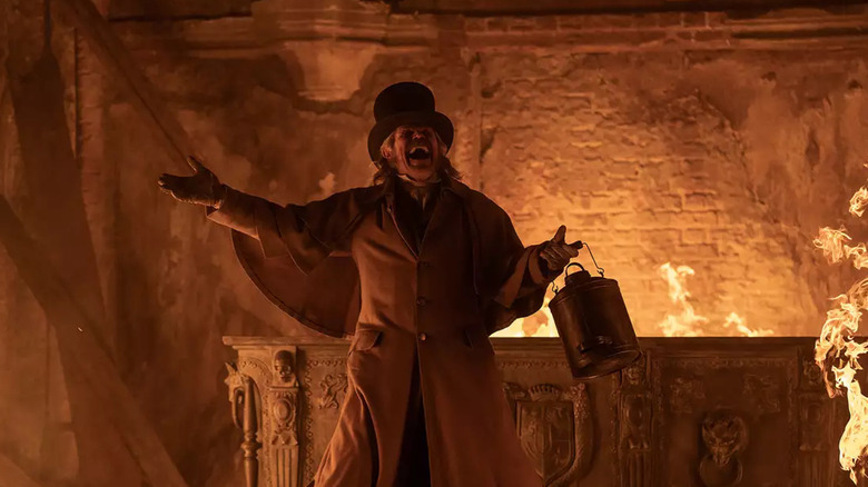 Professor Albin Eberhart von Franz screams surrounded by fire in Nosferatu (2024)