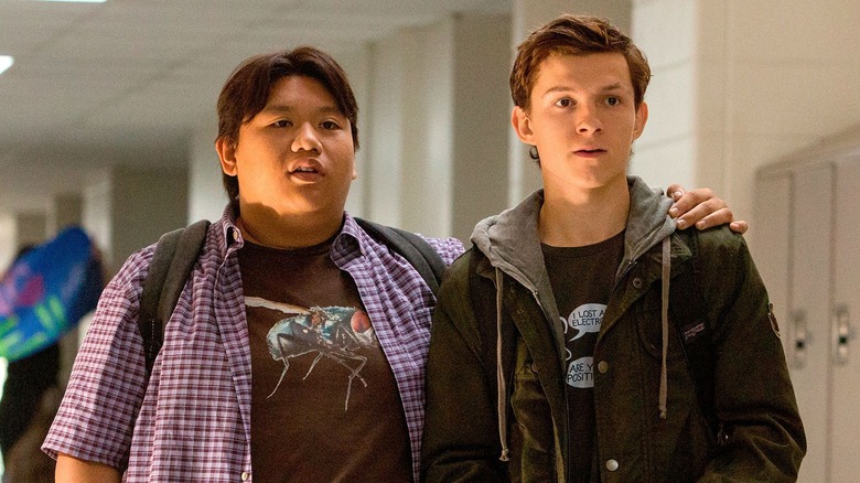 Jacob Batalon as Ned Leeds and Tom Holland as Peter Parker