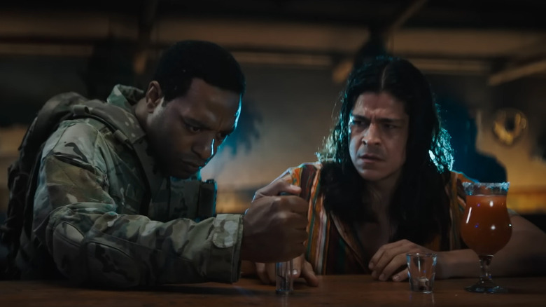 Chiwetel Ejiofor as Strickland, retrieving a symbiote sample in a vial in Venom: The Last Dance