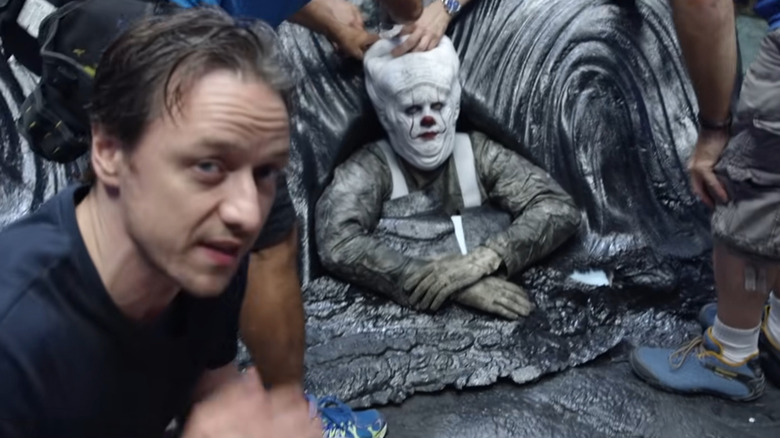 James McAvoy posing with Bill Skarsgard in makeup for It