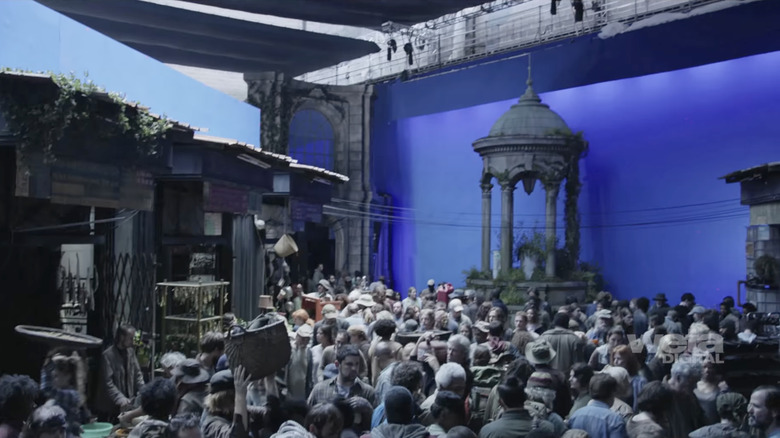 A large group of extras on a blue screen set for Dawn of the Planet of the Apes