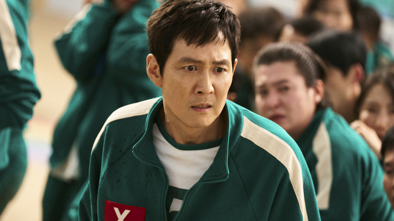 Lee Jung-jae as Seong Gi-hun with a shocked expression on his face in Squid Game season 2