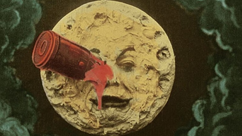 The moon with a face that has a rocket in his eye from George Méliès' A Trip to the Moon