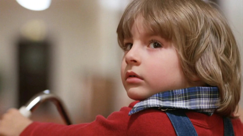 Danny Torrance looking back over his shoulder in The Shining