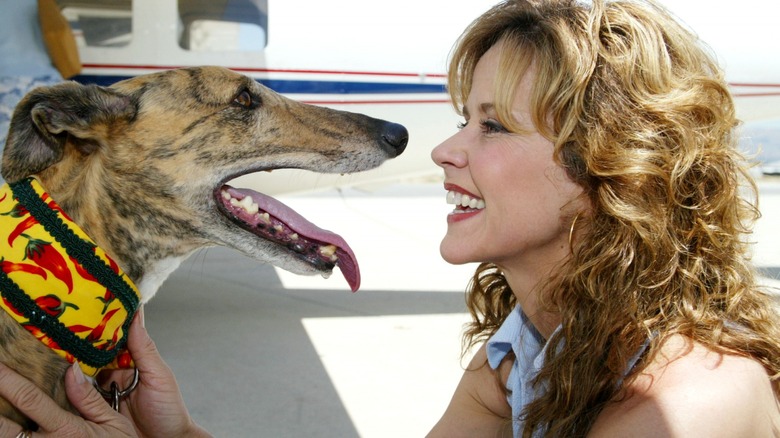 Linda Blair staring at a dog