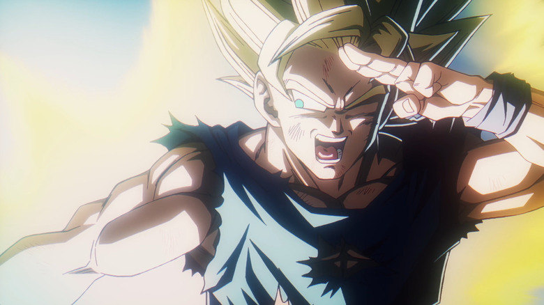 Goku has his fingers at his forehead as he fires a genki dama in Dragon Ball Daima