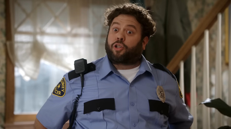 Dan Fogler as Marvin Goldberg dressed as a security officer in The Goldbergs