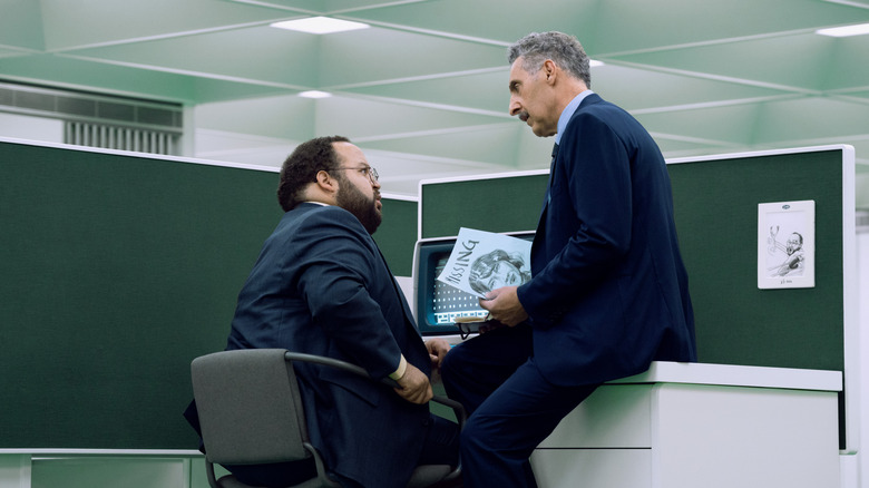 Irving talking to Dylan in the MDR office in Severance