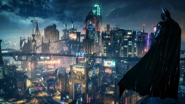 Batman standing on building overlooking Gotham City during rainstorm