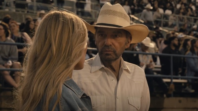 Tommy and Ainsley Norris talking in a football stadium on Landman