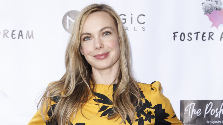 Amanda Walsh smiling at a red carpet event