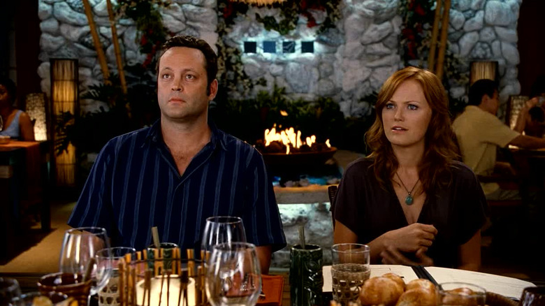 Dave and Ronnie looking perplexed in a restaurant in Couples Retreat