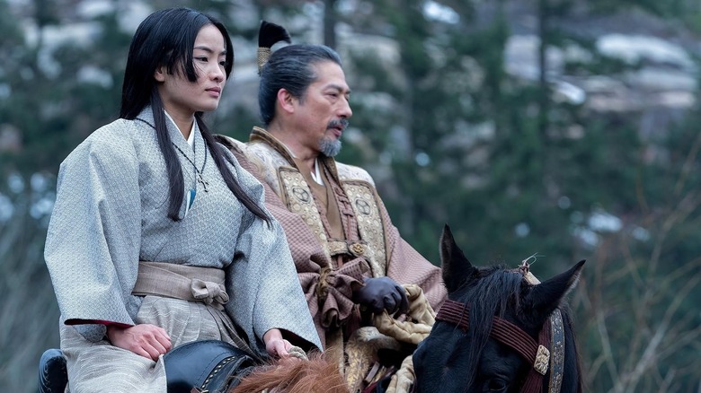 Hiroyuki Sanada's Lord Yoshii and Anna Sawai's Toda sitting on horseback in Shogun