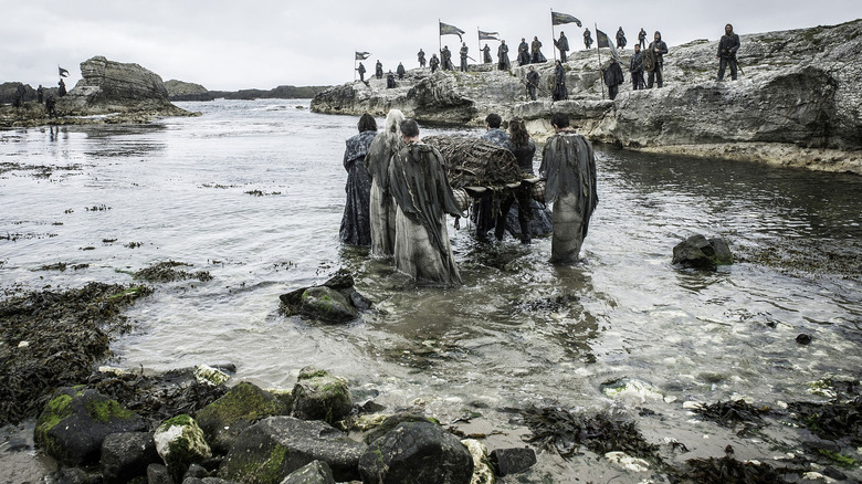 Yara and other Iron Islanders carrying a funeral pyre in Game of Thrones