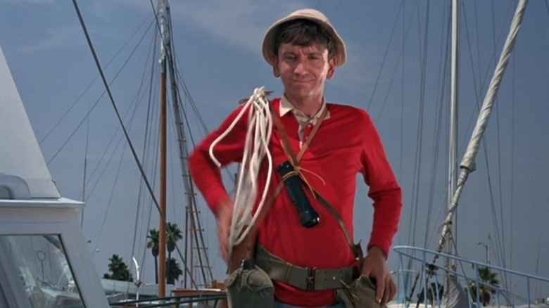 Gilligan standing on a pier in Gilligan's Island