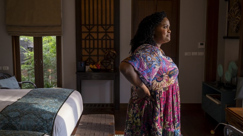 Belinda looking out the window of her room in The White Lotus