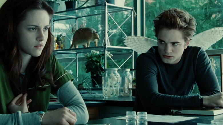 Edward glaring at Bella during science class in Twilight