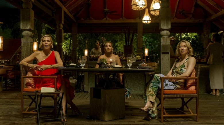 Kate, Jaclyn, and Laurie sitting at a dinner table in The White Lotus