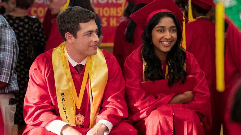 Jaren Lewison's Ben smiles at Maitreyi Ramakrishnan's Devi while the two wait to graduate in Never Have I Ever