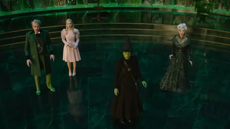 The Wizard Glinda Elphaba and Madam Morrible looking up in Wicked: Part One