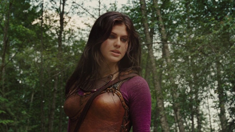 Annabeth, in camp armor, standing in the woods, looking tough.