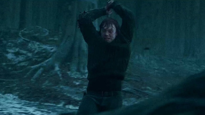 Ron raising the Sword of Gryffindor to destroy the locket Horcrux in Harry Potter and the Deathly Hallows: Part 1