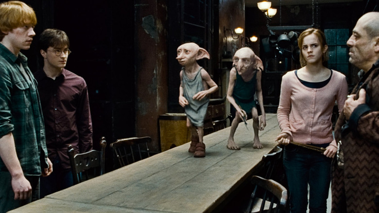 Ron, Harry, Kreacher, Dobby, Hermione, and Mundungus in the Grimmauld Place kitchen in Harry Potter and the Deathly Hallows: Part 1