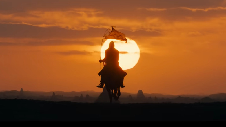 Rider in Rhûn rides toward sunset