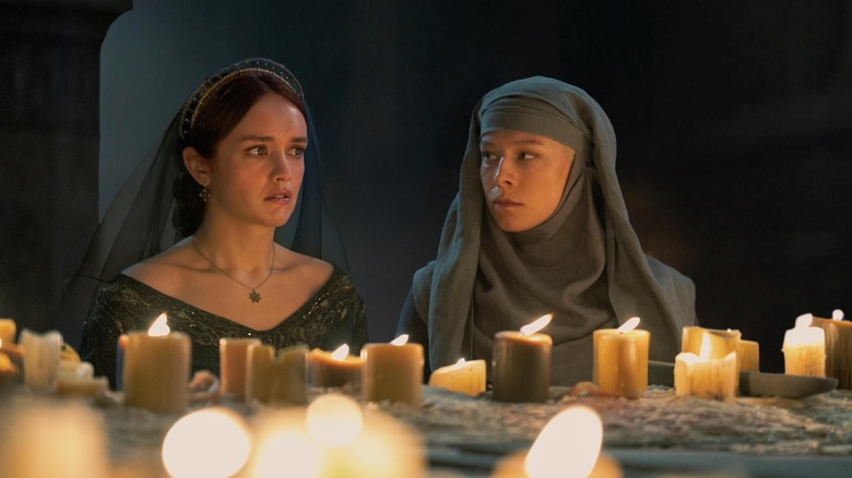 Alicent and Rhaenyra disgusted as a septa praying in the sept in House of the Dragon