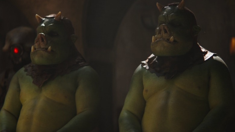 Two green pig troll guys