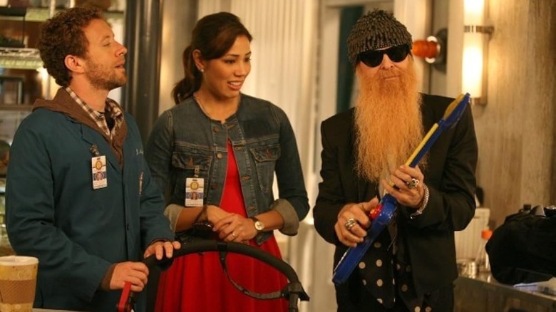 Billy Gibbons as Angela's father with Jack, Angela, and their baby on Bones