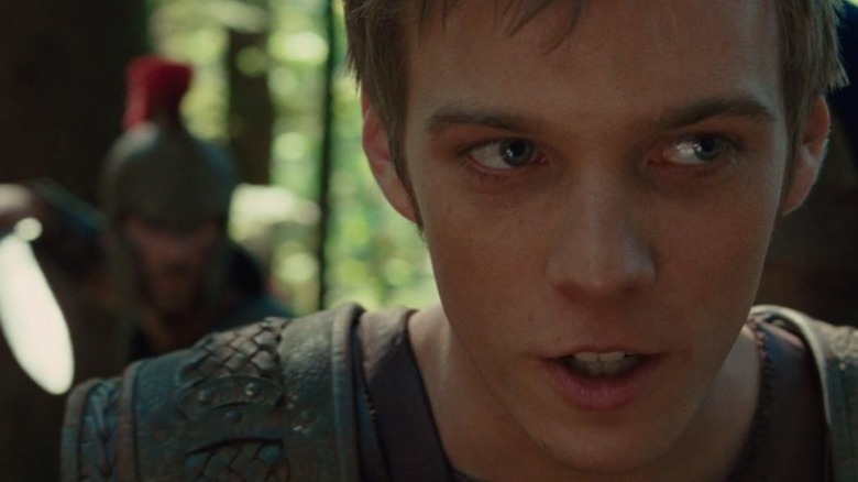 Someone with a plumed helmet and sword sneaks up behind Jake Abel's Luke in Percy Jackson & The Olympians: The Lightning Thief