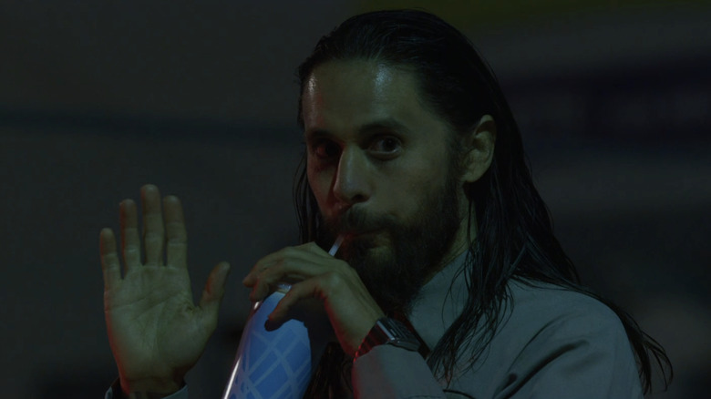 Jared Leto's Albert Sparma waves as he sips a drink in The Little Things