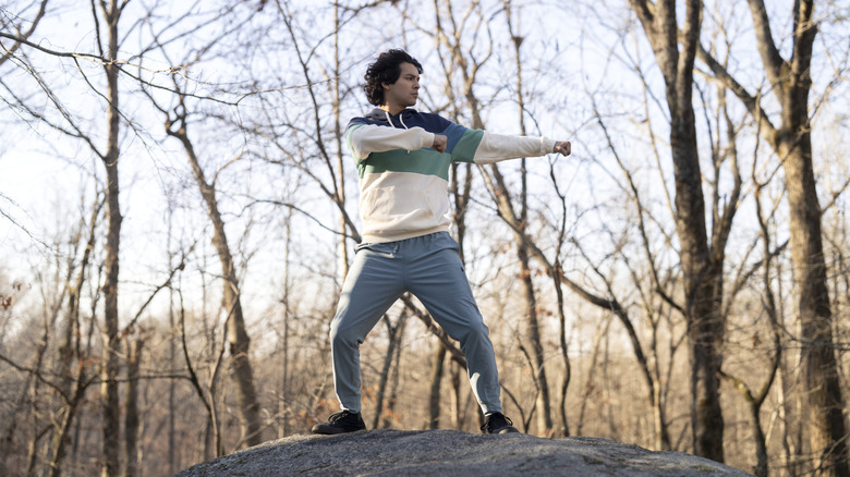 Miguel Diaz drill karate on top of a big rock on cobra cai