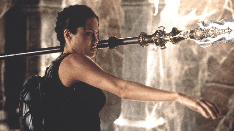 Angelina Jolie wielding a weapon in Lara Croft: Tomb Raider