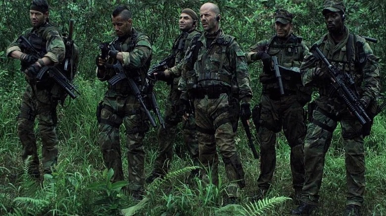 Bruce Willis as Lieutenant Alec Kevin AK Waters with his fellow Navy SEALs in Tears of the Sun