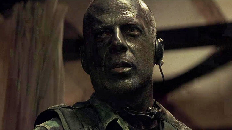 Bruce Willis as Lieutenant Alec Kevin A.K. Waters with camouflage on in Tears of the Sun