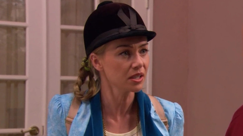 Portia de Rossi's Lindsay Bluth wearing a riding helmet on Arrested Development