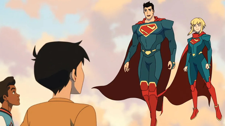 My Adventures with Superman Lois and Jimmy looking up at floating Clark and Kara as Superman and Supergirl