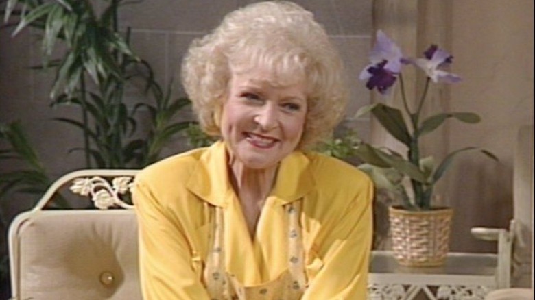Rose Nylund smiling in yellow