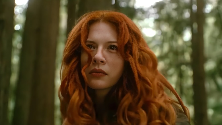 Rachelle Lefevre as Victoria in Twilight: New Moon standing in the woods