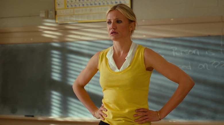 Elisabeth Halsey from 'Bad Teacher,' arm akimbo, looking exasperated at the front of a classroom