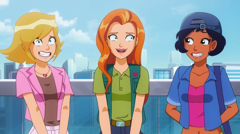 Totally Spies together and nervously laughing