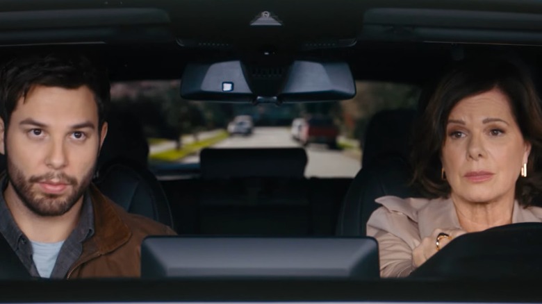 Skylar Astin's Todd and Marcia Gay Harden's Margaret look unhappy in a car in So Help Me Todd