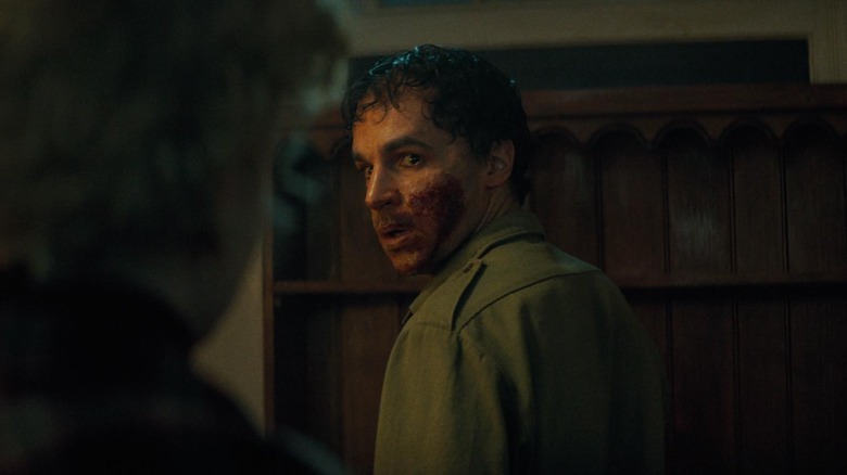 Christopher Abbott's Blake with blood smothered all over his face in Wolf Man