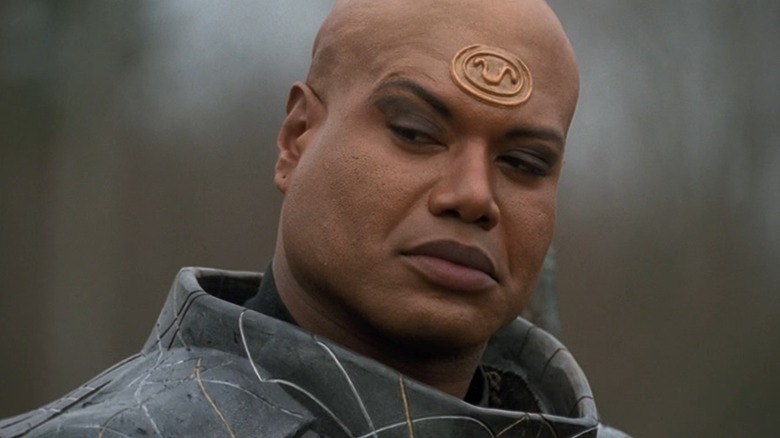 Christopher Judge's Teal'c looks across frame in Stargate SG-1