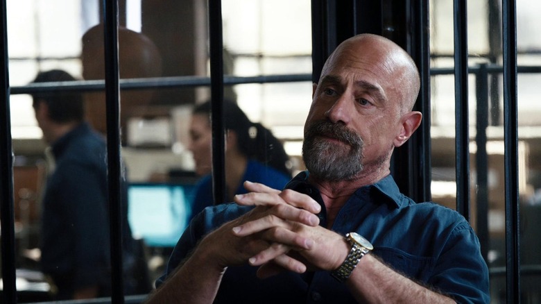 Detective Stabler, sporting a goatee, relaxing in a prison in Law & Order: Organized Crime