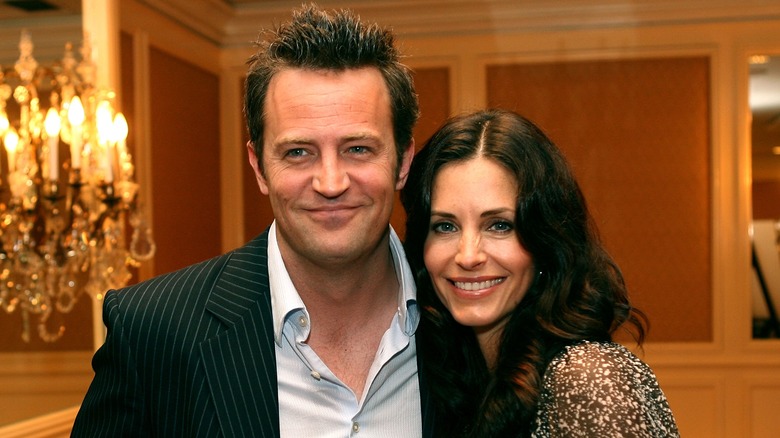 Matthew Perry and Courteney Cox smiling