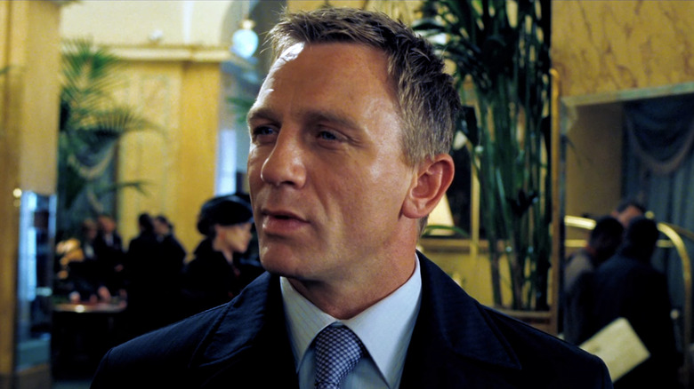 Daniel Craig's James Bond looks off to his right in a hotel lobby in Casino Royale