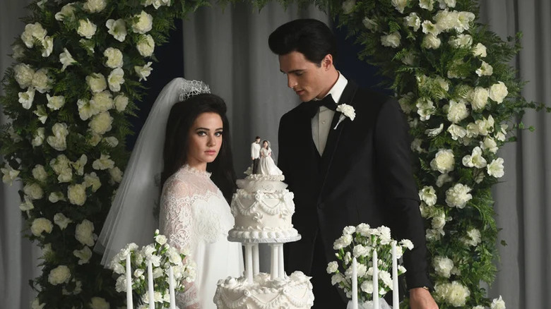 Cilee Spany's Priscilla Presctivey and Jacob Elordi's Elvis Presley stand side by side at their wedding in Priscilla